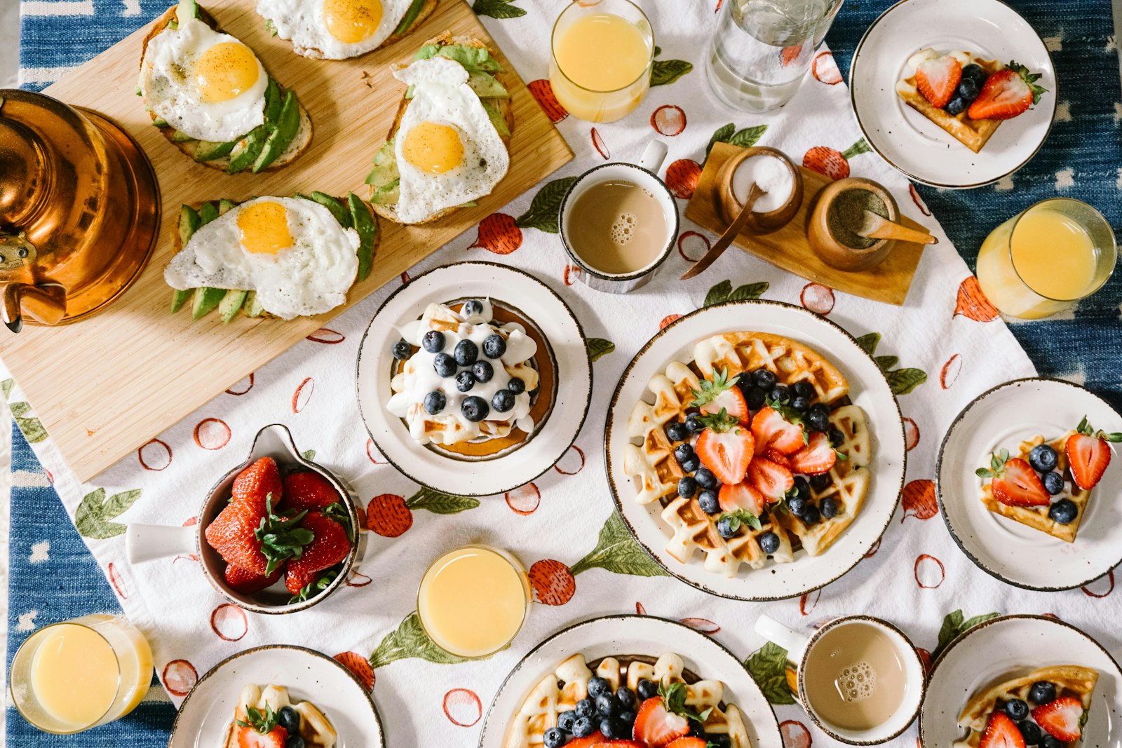 A breakfast spread with bagels and coffee in warm morning light